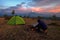 Man Warms On The Campfire. Etna Volcano From Nebrodi Park, Sicily