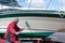 Man washing boat hull with brush