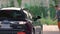 Man washing a car using a high pressure system