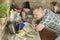 Man washing dirty dishes in the kitchen sink.