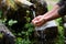 Man washing hands in fresh, cold, potable water