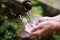 Man washing hands in fresh, cold, potable water