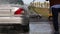 Man washing his car with water spray from high pressure washer. Car wash self-service.