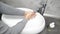 Man washing his hands at the bathroom with water, soap and foam. It\'s important to wash hands in order to avoid virus