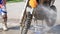 Man washing a race bike after the competition in motocross