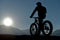 Man watching cycling sport and spectacular sunset in nature