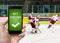 Man is watching ice hockey and is betting online via smartphone