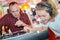 Man watching nervously as young lady plays vinyl record