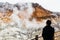 Man watching Noboribetsu Jigokudani Hell Valley: The volcano valley got its name from the sulfuric smell.