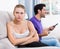 Man watching tv ignoring frustrated girl