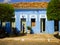 Man watering plants in front of a colonial building in the historic center of Oeiras - Brazil