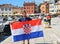 Man waving croatian flag in Rovinj town