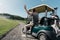 Man waving to friends while riding golf cart before game