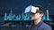 A Man wear VR Headset on digital cityscape background.