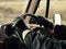 Man wearing black leather driving gloves in vintage vehicle