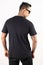 A man wearing blank plain t shirt isolated on white background. Hipster man with tattoo wearing black t shirt in back view.