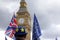 A man wearing a bowler hat with the stars of the EU flag stands in Parliament Square