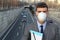 Man wearing a breathing mask in a polluted world