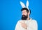 Man wearing bunny plush suit. Funny bunny man with beard and mustache. Easter symbol concept. Guy bearded hipster cute