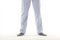 Man wearing a casual pajama. Legs detail. White background