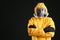 Man wearing chemical protective suit on background, space for text. Virus research