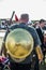 Man wearing a gold shield on display