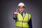 The man wearing hard hat and construction vest