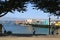 A man wearing a hat walks on the path by Old Fisherman`s Wharf, Monterey.