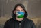Man Wearing a hood and a Djibouti flag Mask to Protect him virus