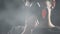 Man wearing respirator, standing in room full of smoke, nicotine influence