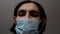 Man wearing a surgical face mask covering the lower half of his face.medical and healthcare concept