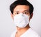 Man wearing surgical hygienic protective cloth face mask against coronavirus