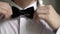 Man wears black bowtie