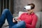 Man wears virtual reality glasses with smartphone inside