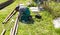 A man welder with construction gloves and a welding mask working with a metal outdoors