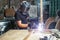 Man welds a metal arc welding machine