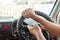 A man at the wheel holding a smartphone in his hand, violates traffic rules. The concept of an accident, a traffic violation, the