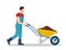 Man with wheelbarrow full of dirt or ground.