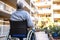 Man in Wheelchair Gazing Out Window, Depicting Loneliness and Solitude