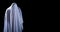 The man is in white clothes and shows a scary looking face on isolated black background, look like ghost in night for Halloween