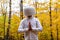 Man in white has a crystal bowl on his head while showing thankfulness