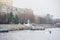 A man in a white kayak near the city riverbank01