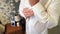 Man in white shirt fastens cufflinks