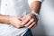 Man in white shirt and metallic wrist watch