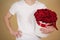 Man in white t shirt holding in hand rich gift bouquet of 21 red