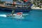 The man who sells ice cream in a boat to tourists in the turquoise sea