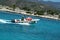 The man who sells ice cream in a boat to tourists in the turquoise sea