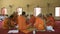 Man who will become buddhism monk praying in ordination ceremony