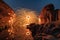 Man wielding rounded burning fire spark from steel wool in rock rapids of grand canyon reflection on river at Hat Chom Dao