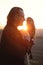 Man and wild bird Owl over sunset sky in field Power, Wisdom